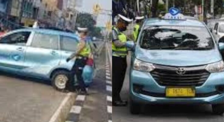 Viral! Taksi 'Tersangkut' di Pembatas Jalan Bikin Repot